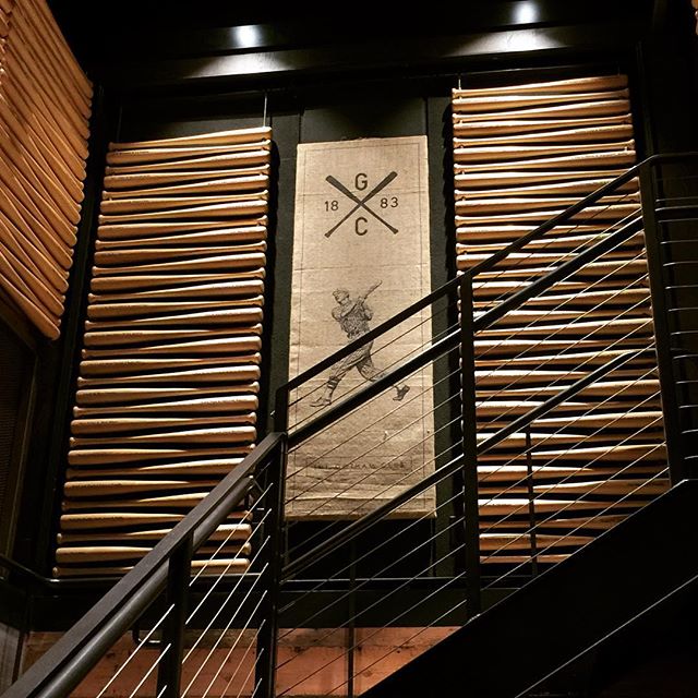Great shadow pattern on baseball bats in the entrance to the Gotham Club at Pac Bell Park in San Francisco . I love great examples of shadow as a design element. This club is hidden below the outfield wall.