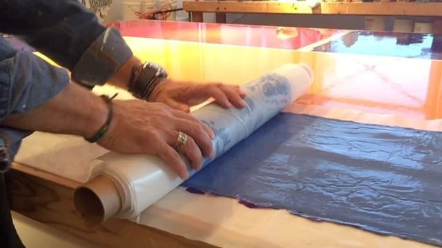 In the studio: Day six of pouring and peeling giant sheets of blue paint. Finally dry and now rolling up and storing the paint skins . @gracejhuber is again today's studio assistant imported from Atlanta. . .