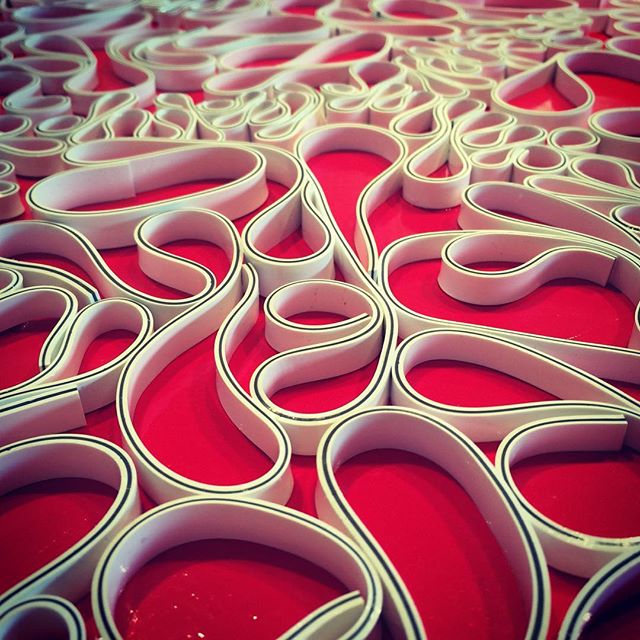 In the studio: texture detail from today's project. Blood red piece for a bold show entry.