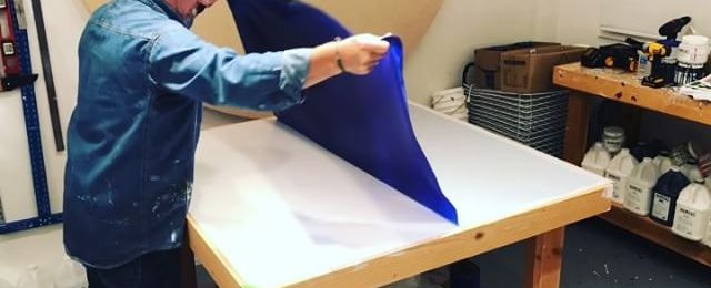 In the studio: Peel and roll day for one of the 7 colors being produced for new projects. This is the last of the luscious blue pieces with many more days of creating paint fabric to go. A long way until this material gets used in an artwork. Thanks for watching. Stay tuned. . . . .